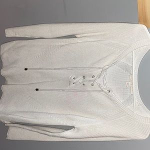 White V-neck sweater with cross lacing on chest